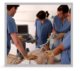 A group of clinicians performing an ultrasound on a patient.