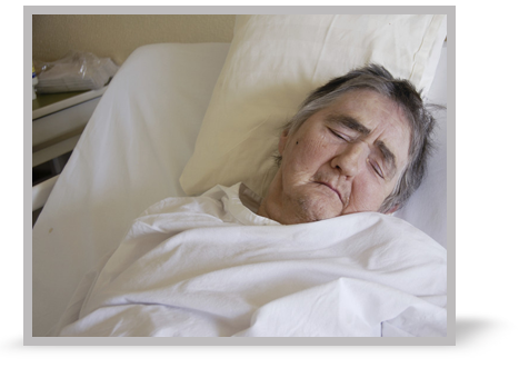 Mrs Brown – a 75-year-old woman in a hospital bed.