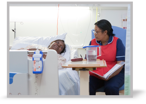 A 65-year-old woman in a hospital bed.