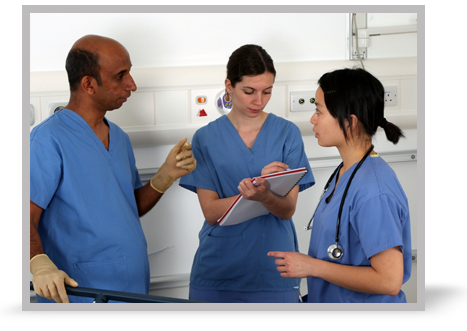 A picture of three clinicians talking.