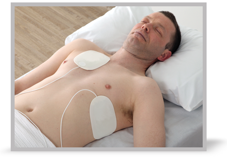 A patient with self-adhesive pads attached. 